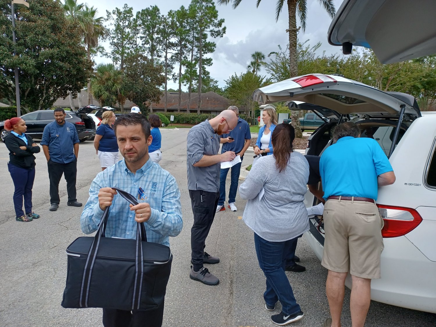 Volunteers pack automobiles with meals created for Jay Fund families by PGA TOUR Chef Eric Butcher and his team. The meals were delivered by volunteers to the families on Sept. 17.